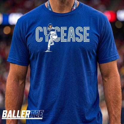A man wearing a royal blue t-shirt with a white graphic that reads 'CYCEASE' and features a football player illustration. The brand 'BALLERTEE' is visible as a watermark in the bottom-left corner.