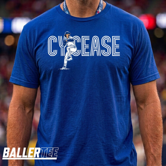 A man wearing a royal blue t-shirt with a white graphic that reads 'CYCEASE' and features a football player illustration. The brand 'BALLERTEE' is visible as a watermark in the bottom-left corner.