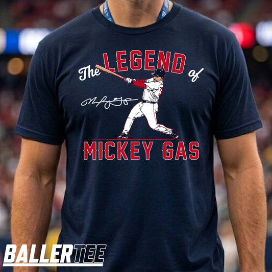 A man wearing a navy blue t-shirt with a graphic print of Mickey Mantle in a baseball uniform and the text 'The LEGEND of MICKEY GAS' with a signature. The brand name 'BALLERTEE' is visible in the bottom-left corner.