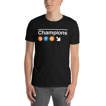 New York basketball 2026 Champions t-shirt in black – NYC subway-inspired graphic with NYK lettering in orange and blue circles by BallerTee
